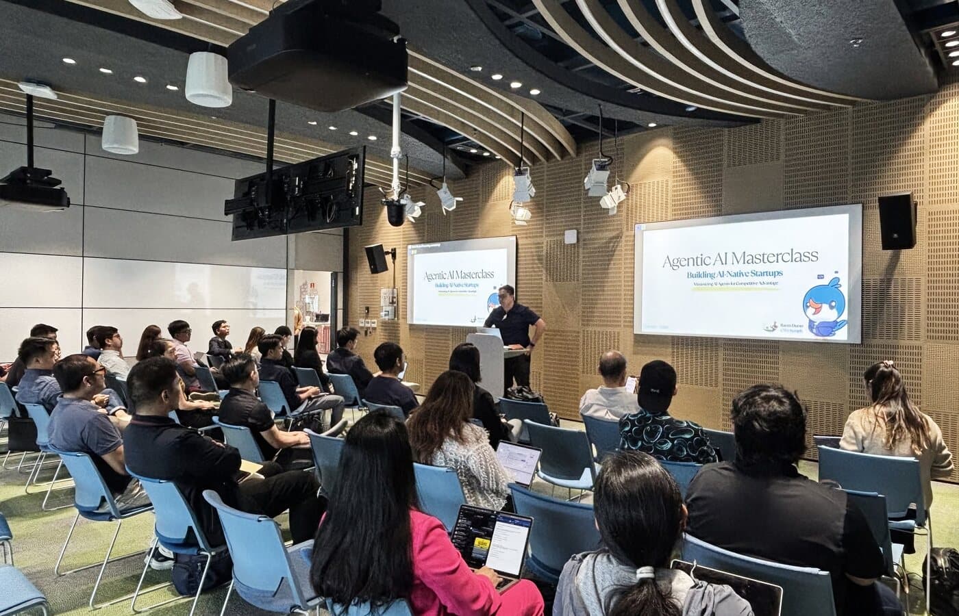 Raven Duran leading an AI workshop with an audience